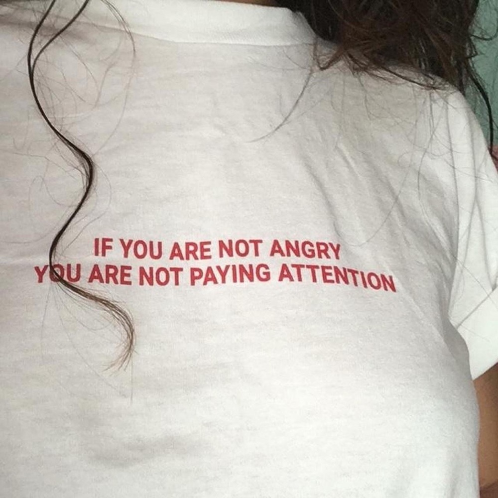 “If you are not angry, you are not paying attention” t-shirt in a size small
